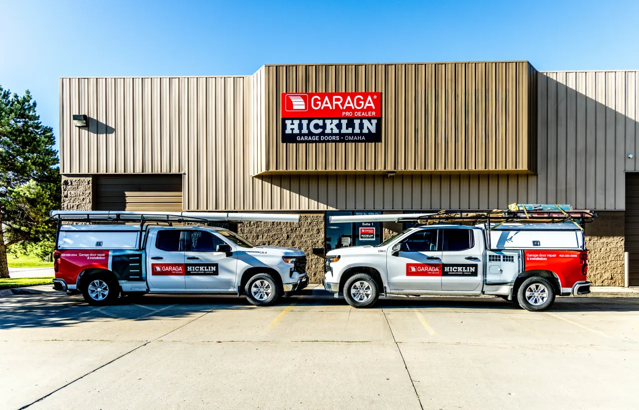Garage door specialist with customer in a garage door shoowroom in Omaha