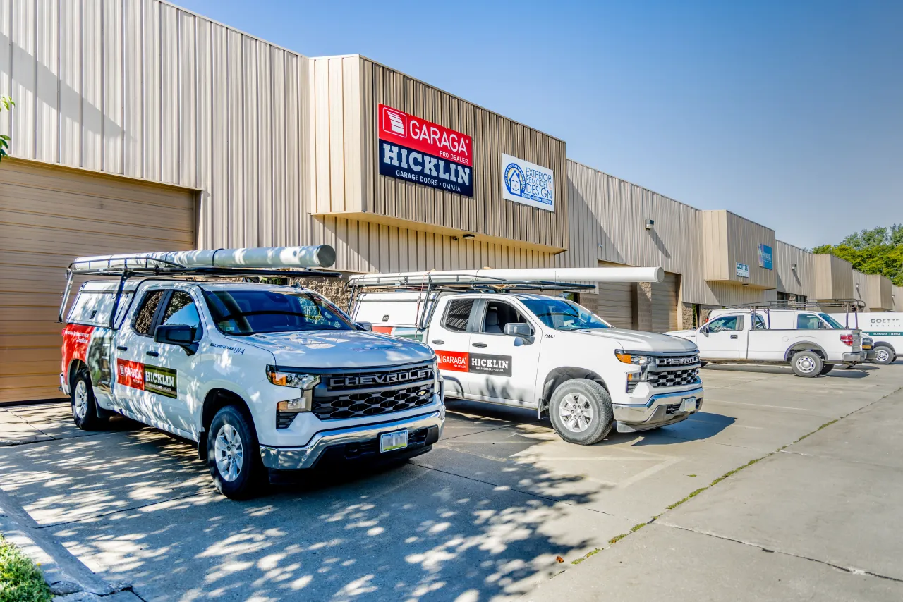 Garage door service trucks in front of Hicklin Garage Door Omaha office